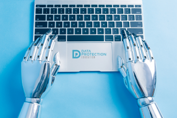 Robot hands typing on a laptop with the Data Protection Education logo on it, blue background